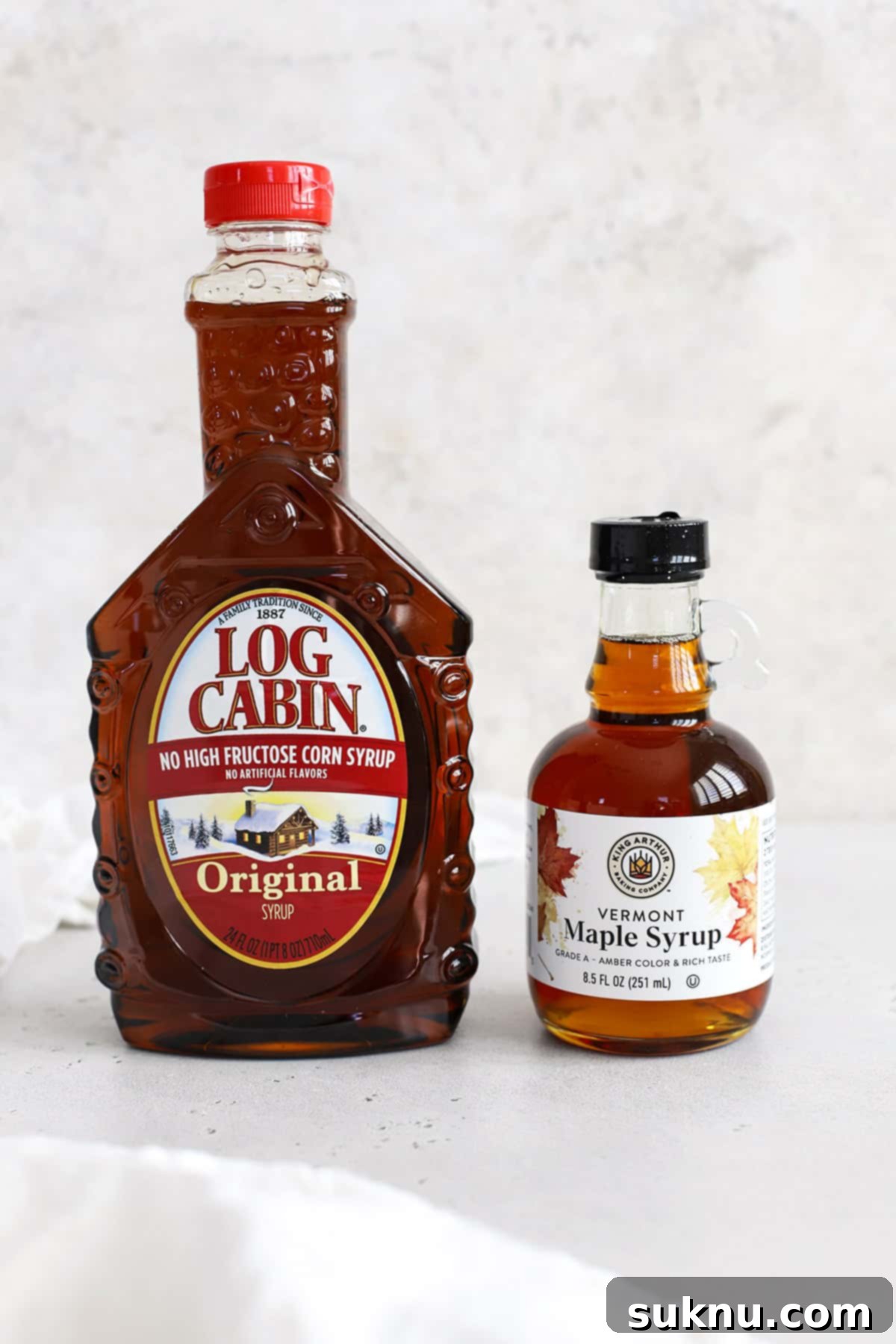The Gluten-Free Verdict On Maple Syrup 3 Front view of a bottle of pancake syrup and a bottle of pure maple syrup, illustrating the visual difference.