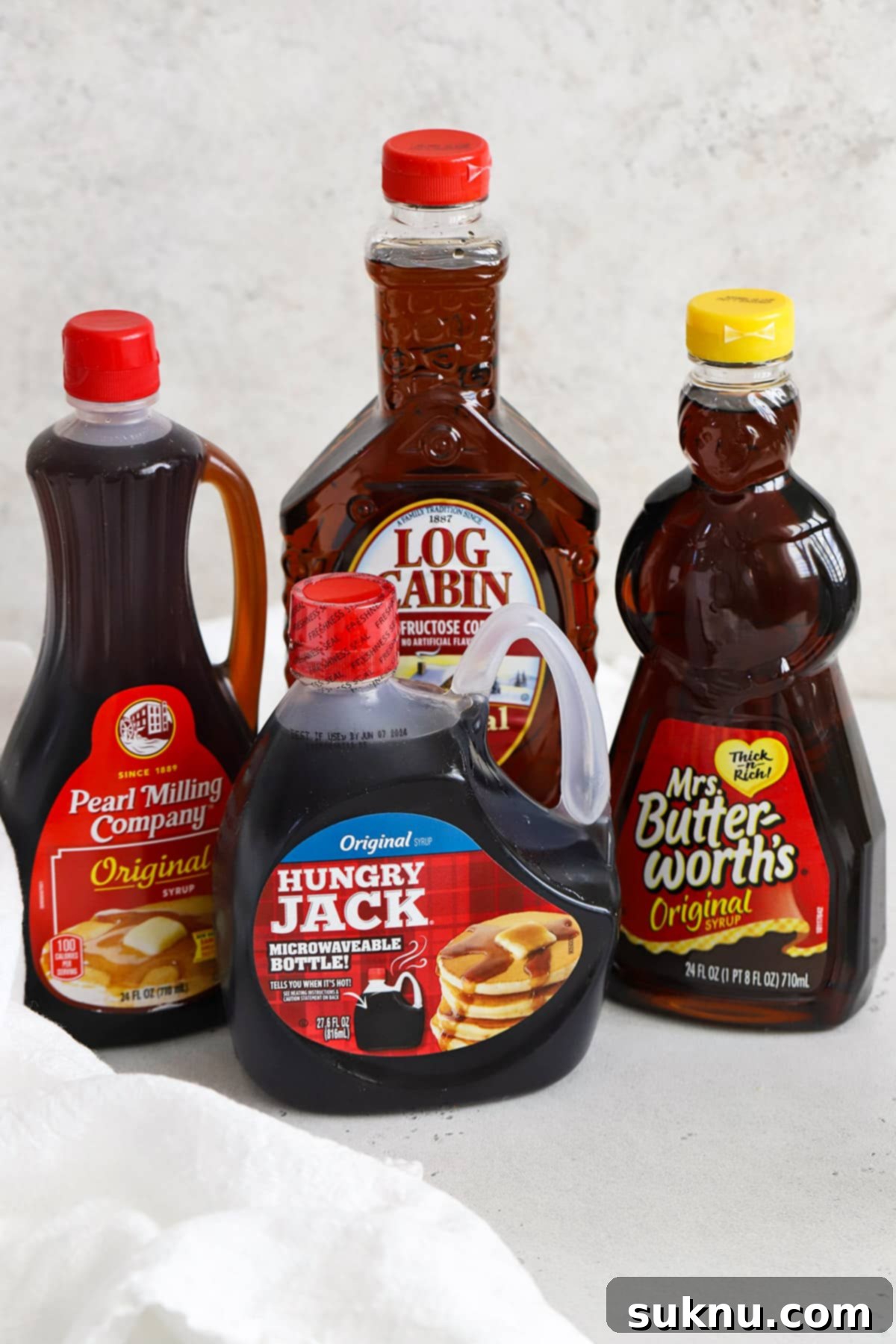 The Gluten-Free Verdict On Maple Syrup 6 Front view of bottles of gluten-free pancake syrup, indicating safe options.