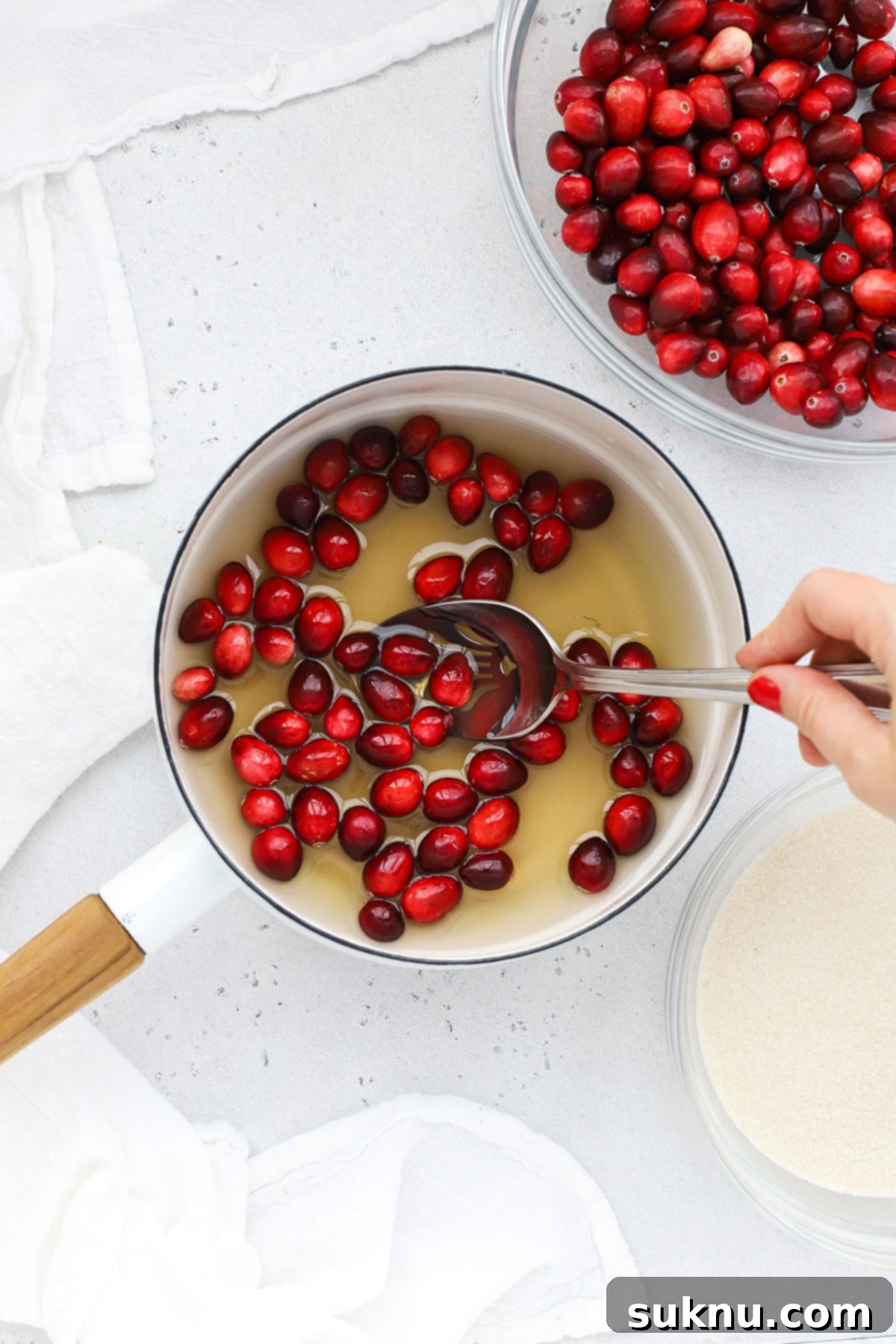 Sparkling Sugared Cranberries 5 Dipping fresh cranberries in simple syrup to make sugared cranberries