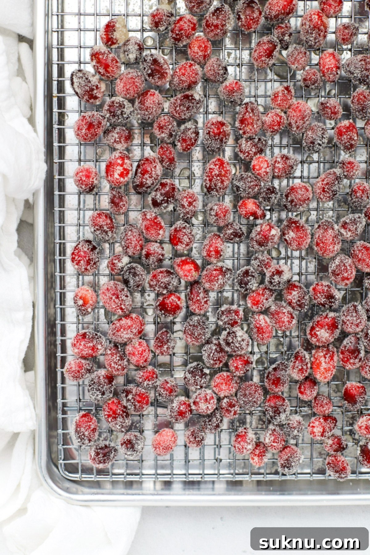 Sparkling Sugared Cranberries 9 Sugar covered cranberries on a cooling rack