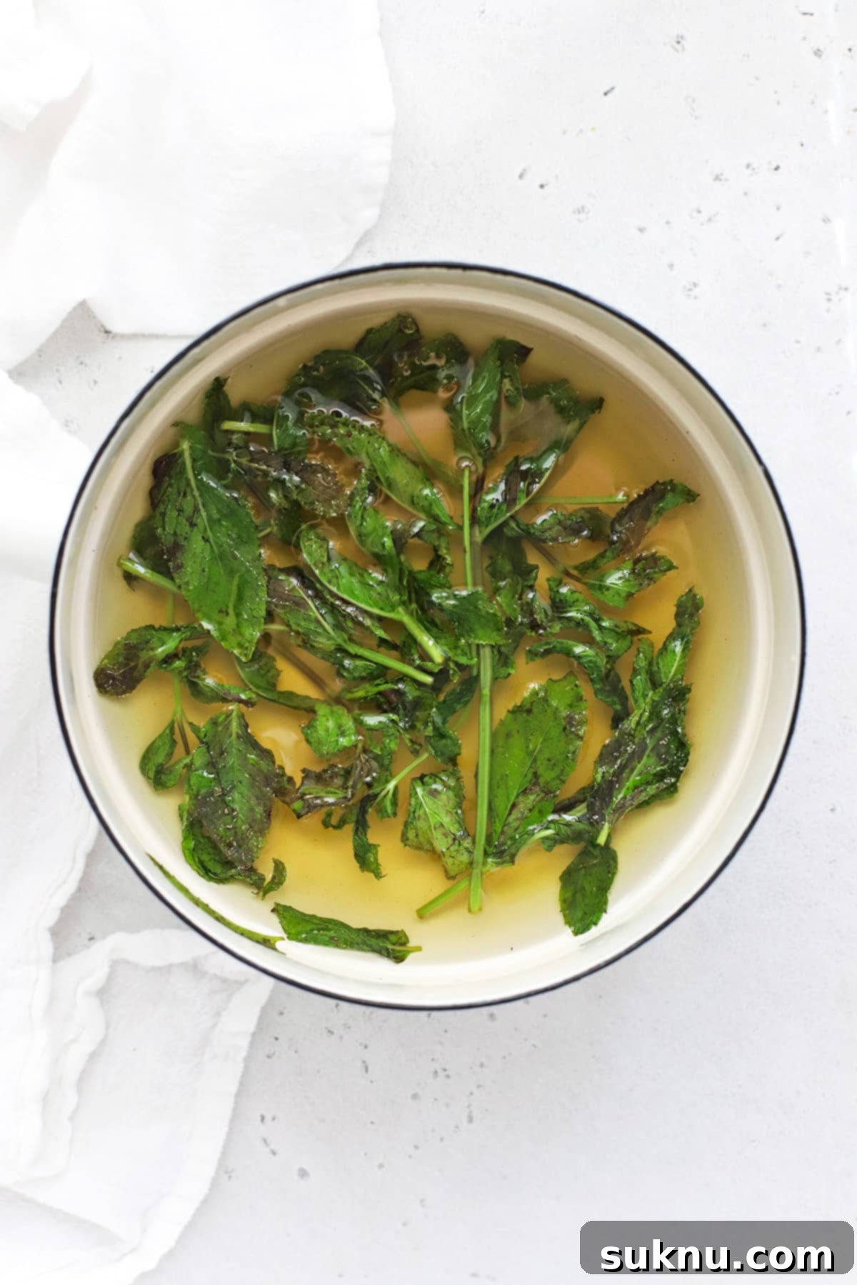 Sparkling Cranberry Lime Delight 4 Steeping mint leaves to make mint simple syrup