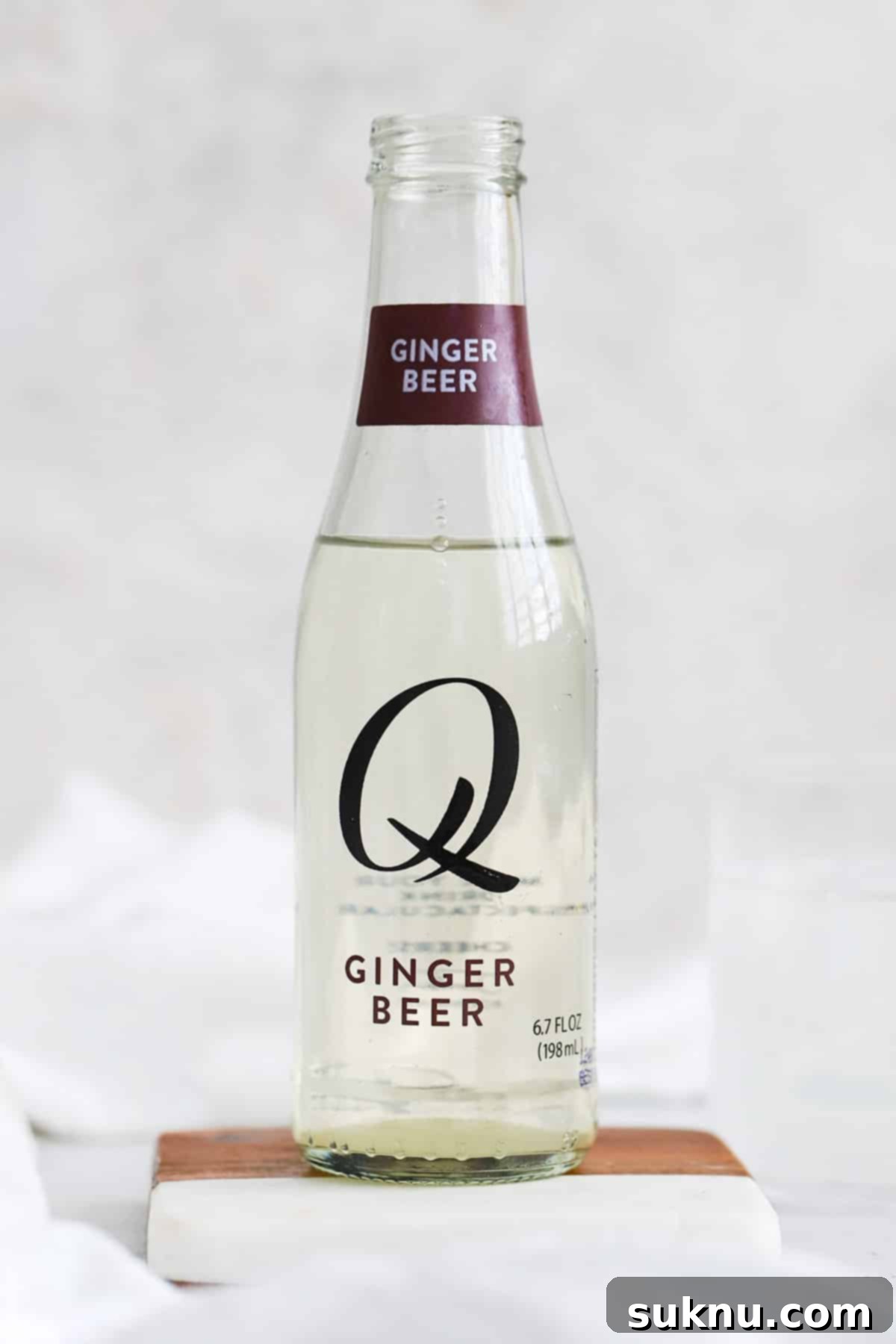 front view of a bottle of q mixers ginger beer