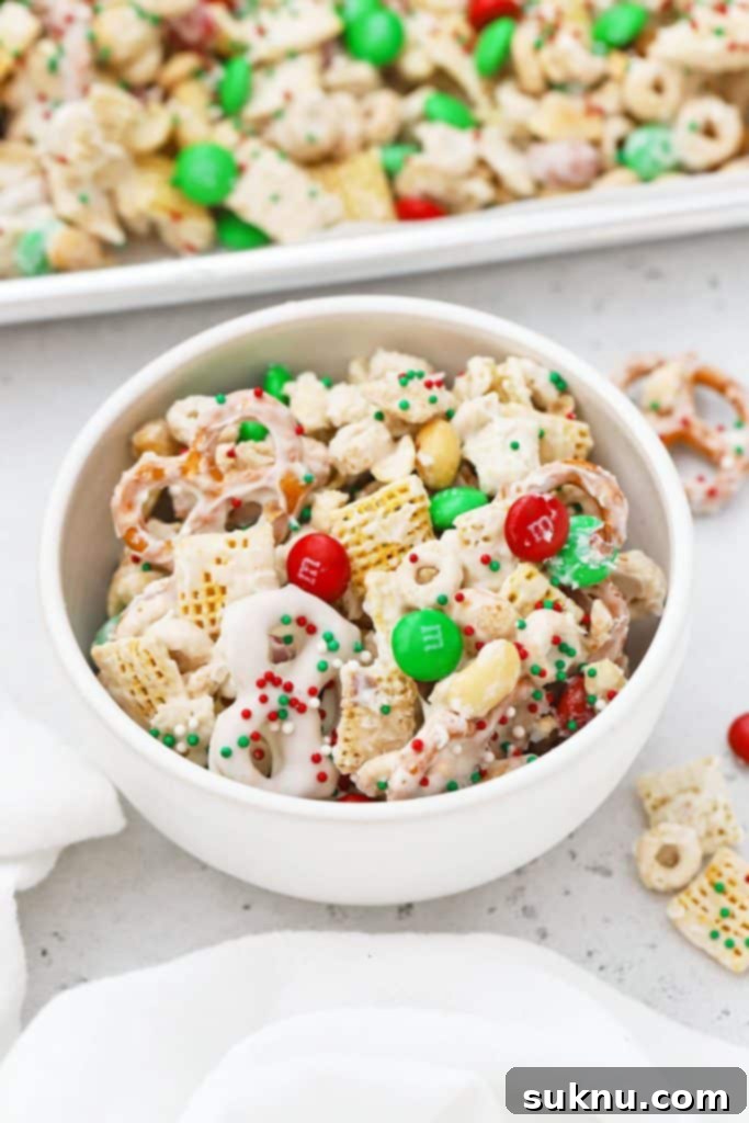 Decadent Gluten-Free Oreo Truffles 10 Large white bowl of gluten-free holiday chex mix with m&ms and pretzels