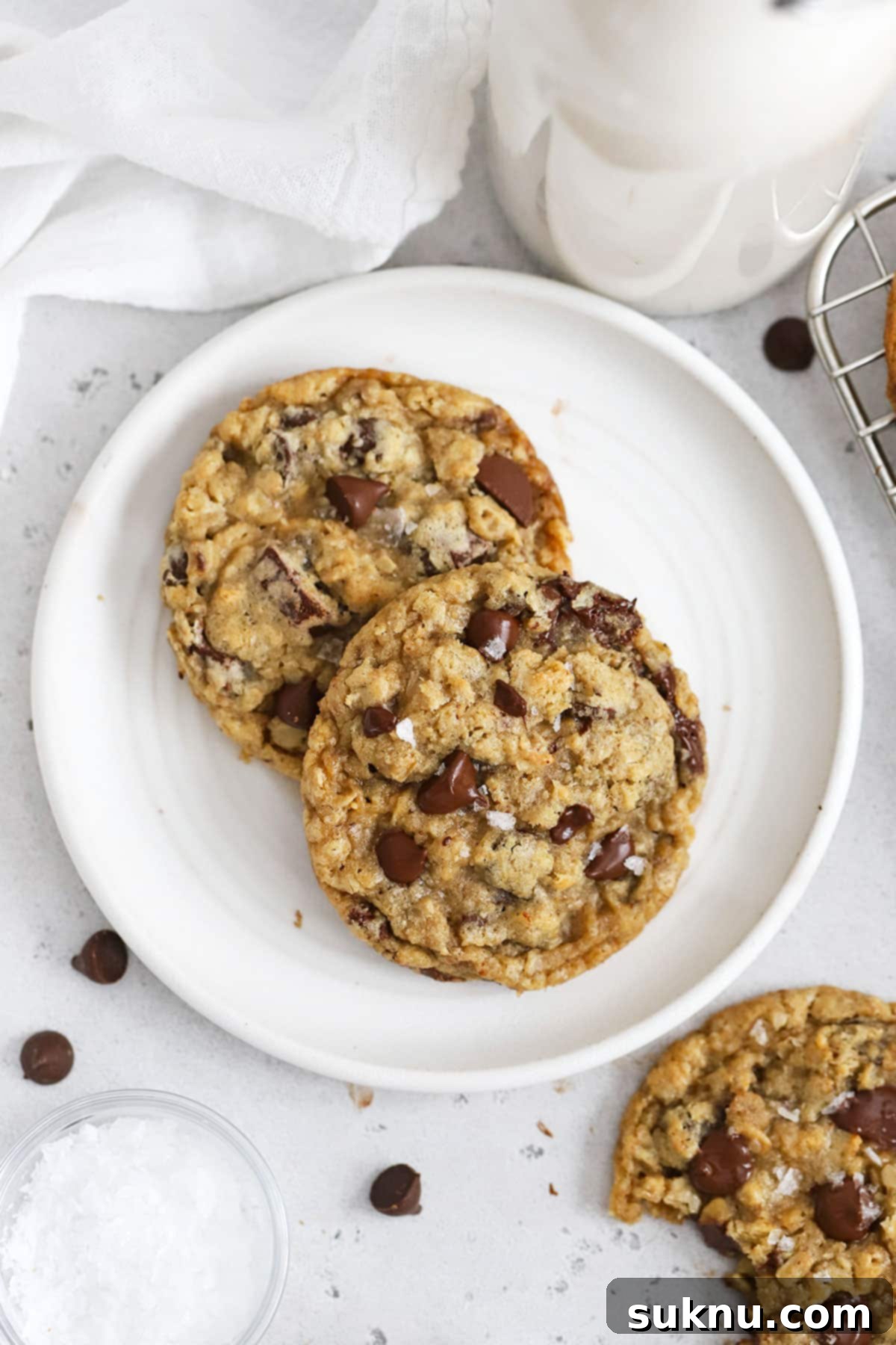 Soft and chewy Gluten-Free Oatmeal Chocolate Chip Cookies on a white plate