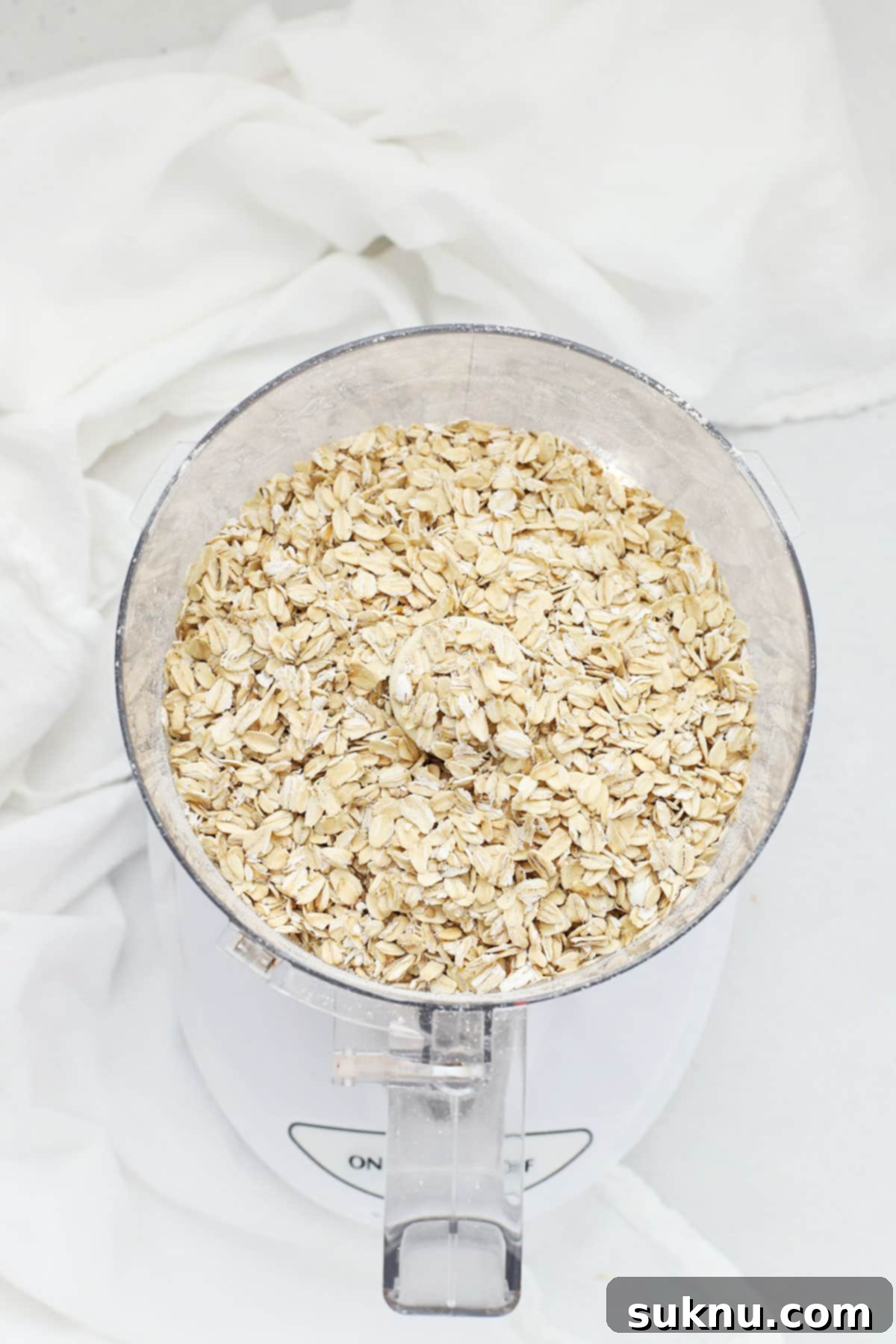 A close-up of gluten-free rolled oats, ready to be ground for cookies