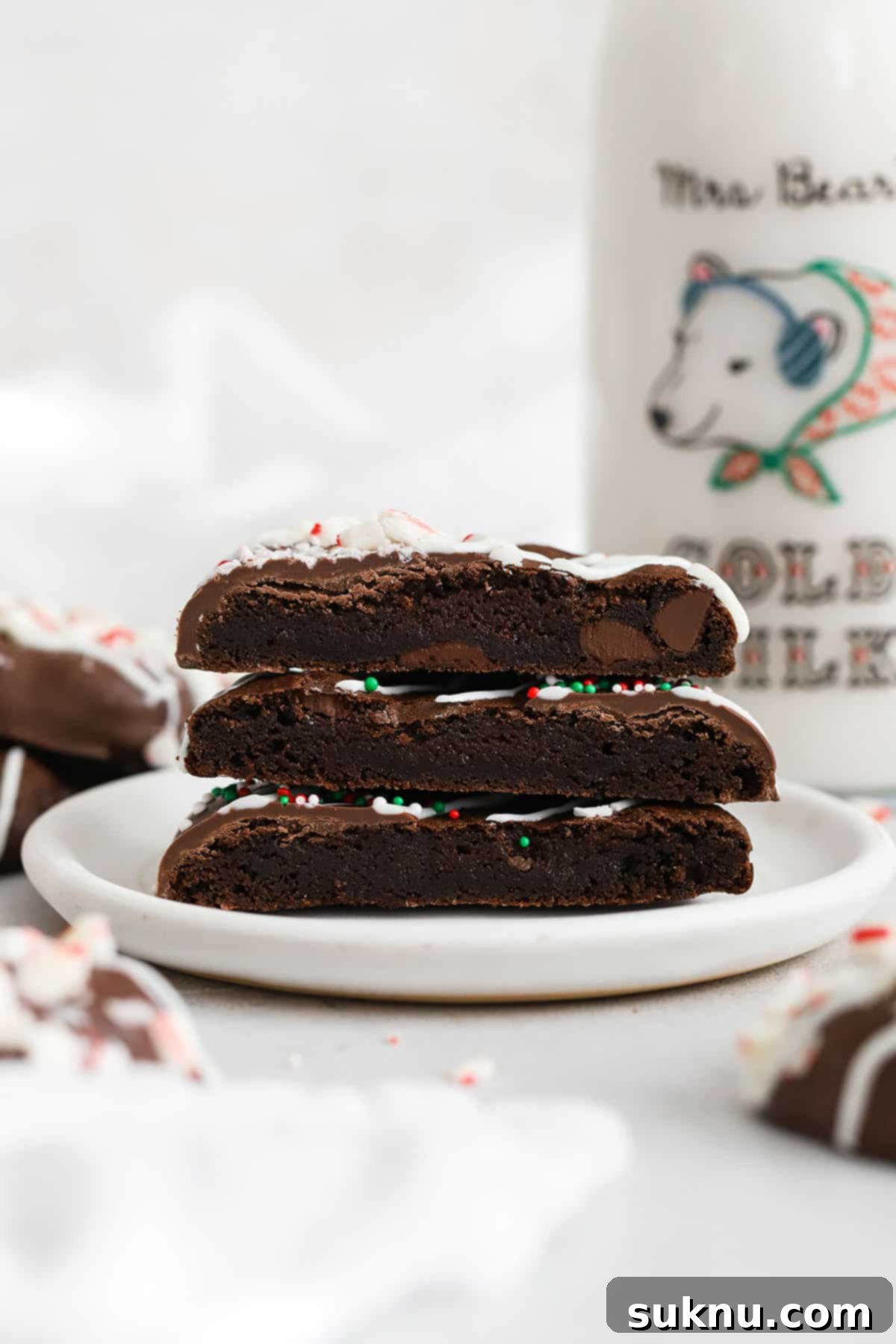Gluten-free chocolate peppermint cookies cut in half to show the fudgy interior