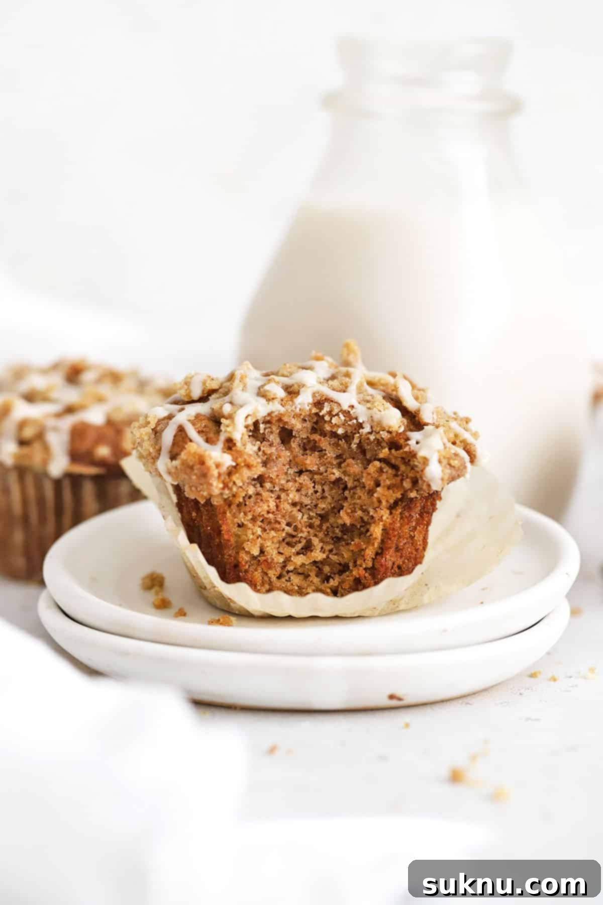 Gluten-Free cinnamon muffins on white plates, ready to be enjoyed.