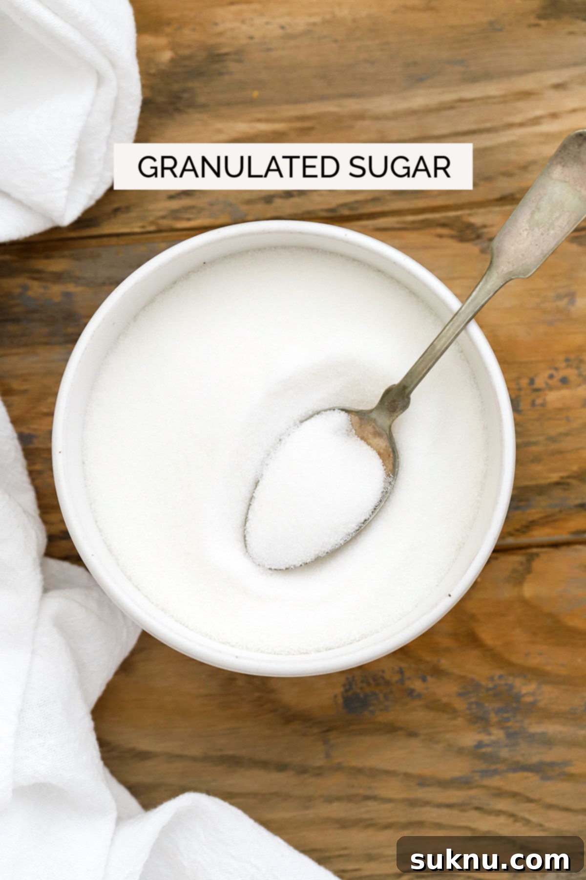 Mastering Sweetness: 12 Sugar Types and Their Culinary Applications 3 granulated sugar in a white bowl