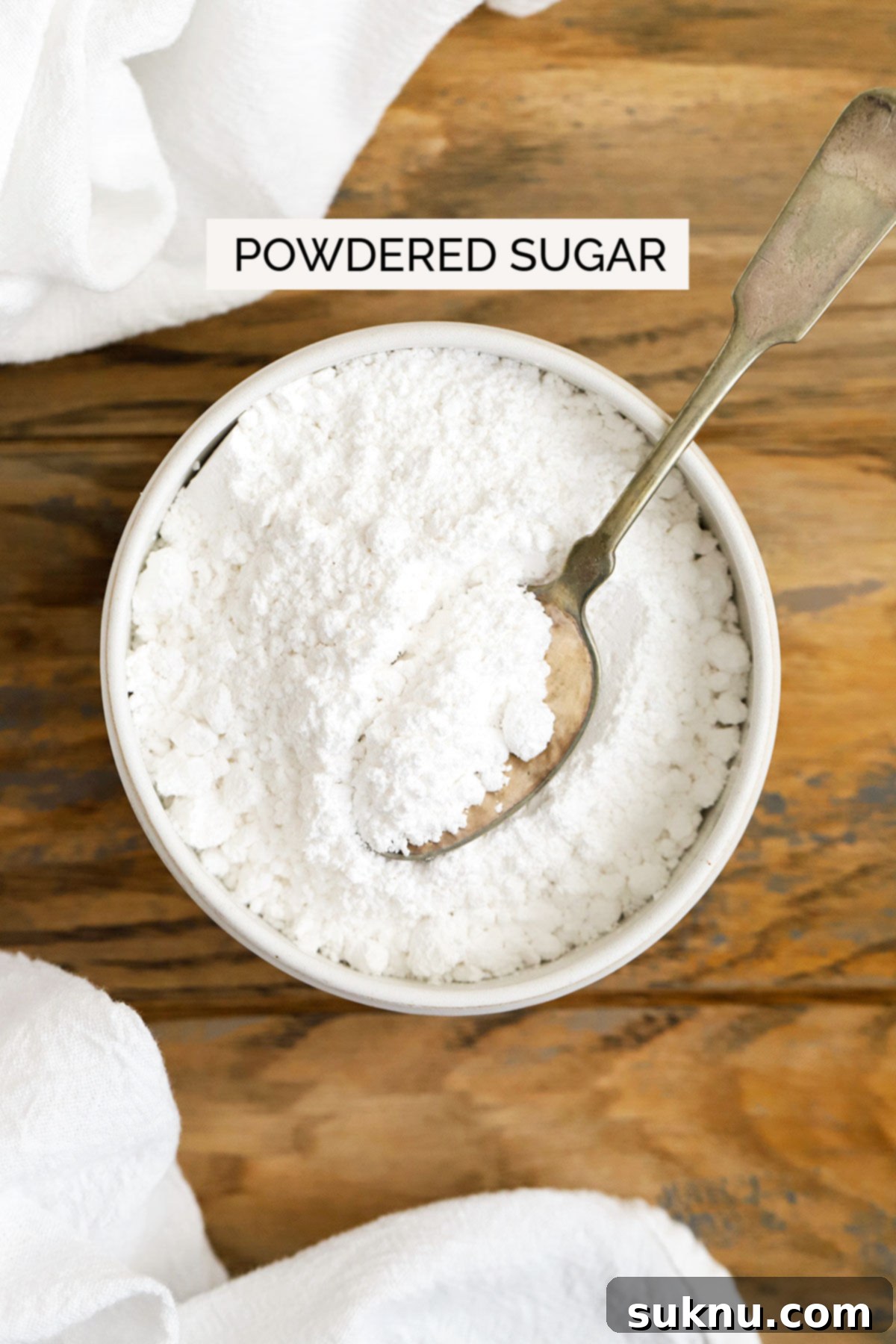 Mastering Sweetness: 12 Sugar Types and Their Culinary Applications 5 powdered sugar in a white bowl