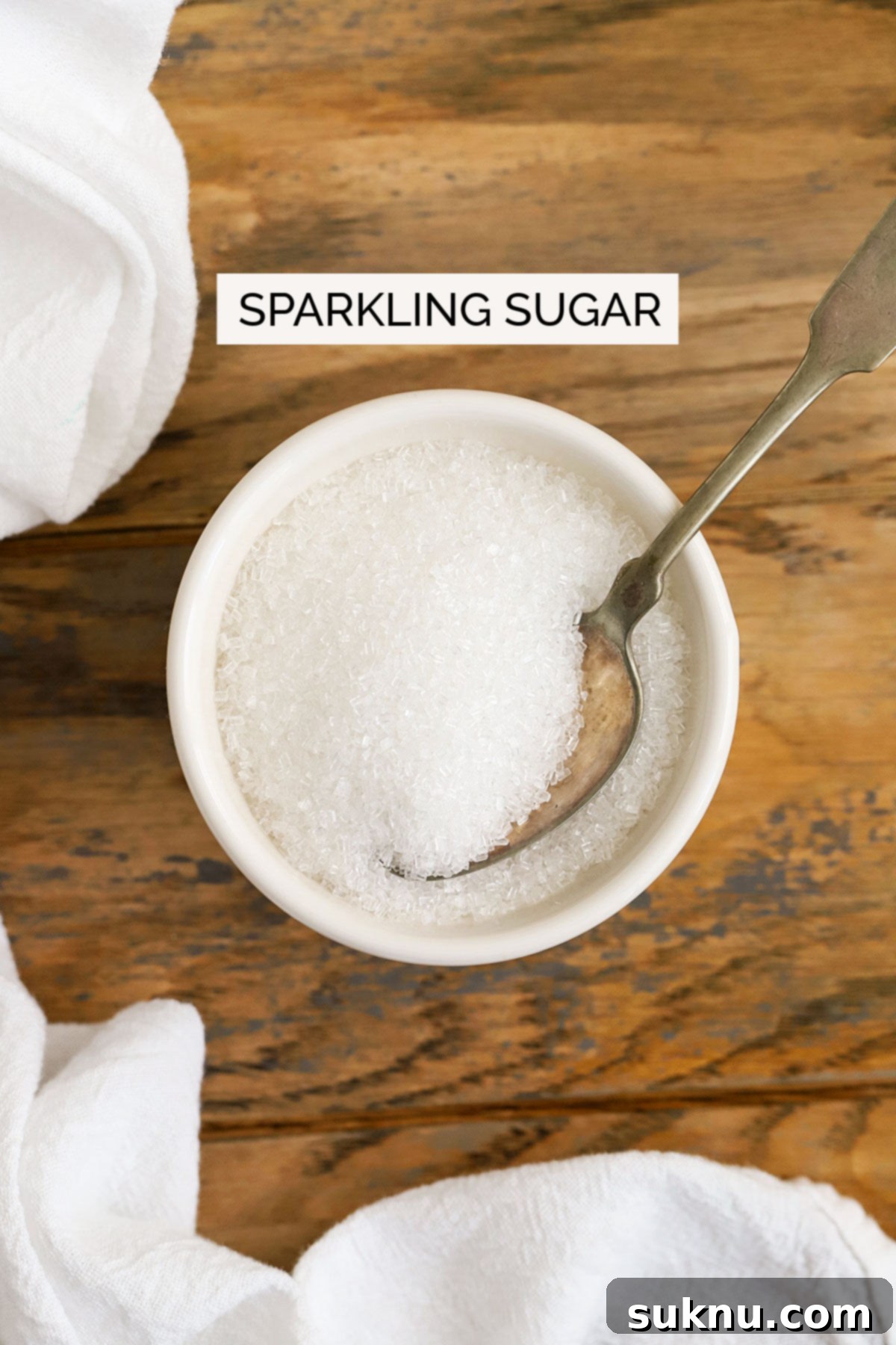 Mastering Sweetness: 12 Sugar Types and Their Culinary Applications 10 sparkling sugar in a white bowl