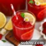 Perfect Raspberry Lemonade 11 glasses of fresh raspberry lemonade garnished with mint and lemon slices