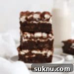 Gooey Gluten-Free Marshmallow Brownies 12 three gluten-free marshmallow brownies stacked on a plate