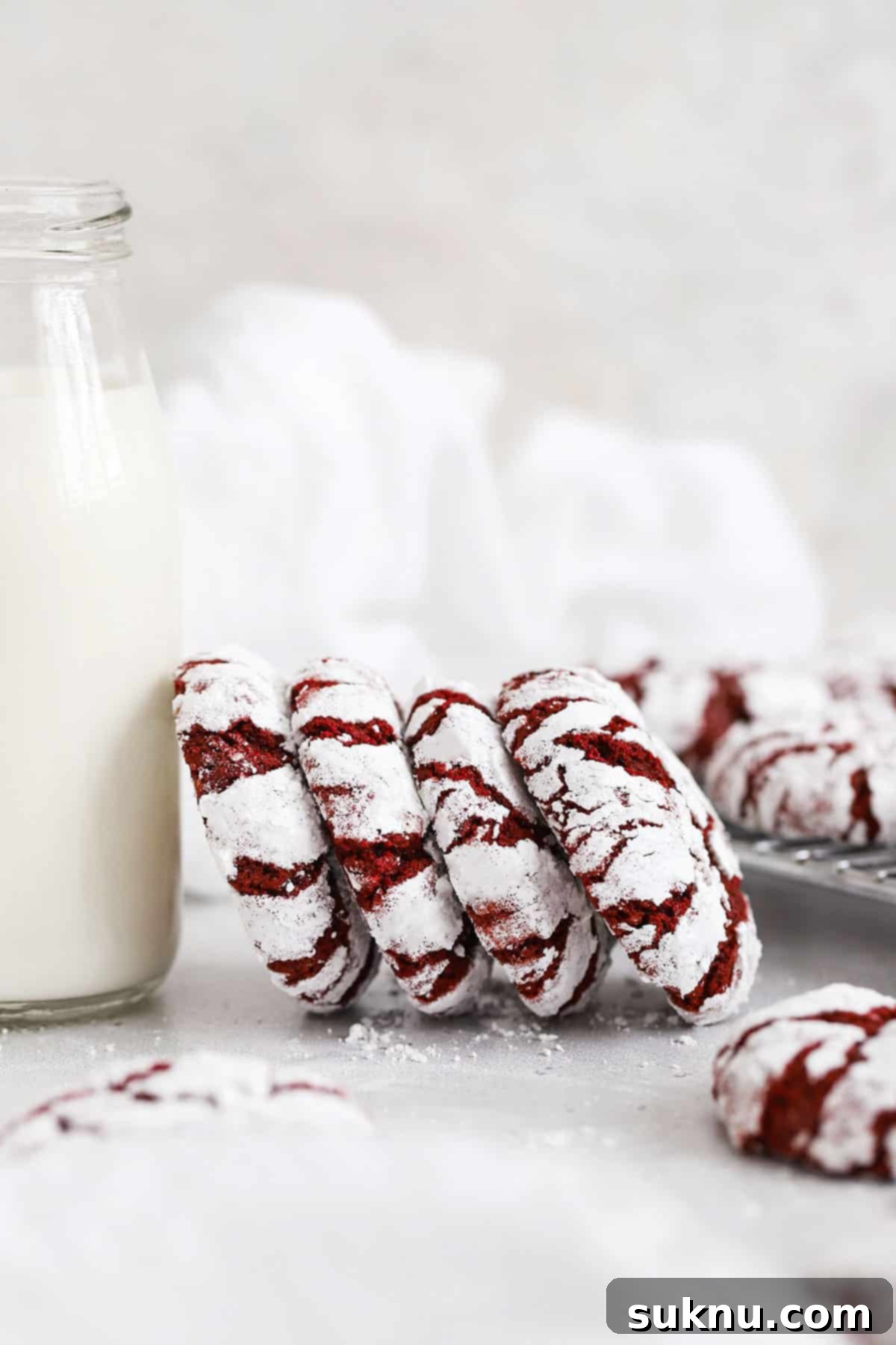Irresistible Gluten-Free Red Velvet Crinkle Cookies 7 Gluten-free red velvet cookies on a white background