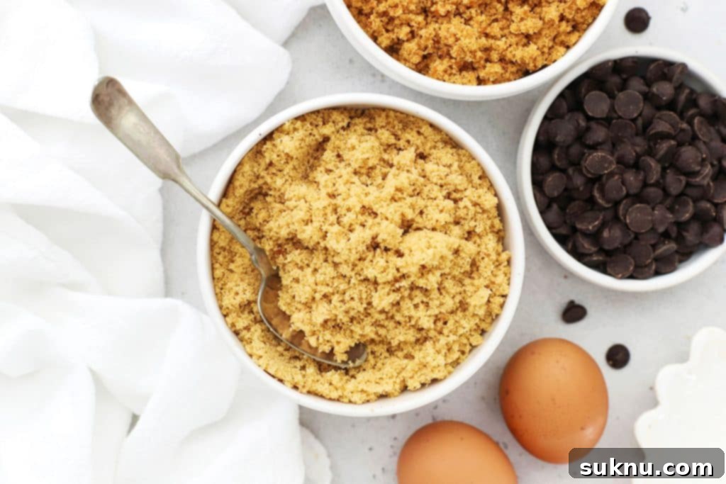 Revive Your Hard Brown Sugar 12 A bowl of homemade brown sugar alongside other cookie ingredients like flour, eggs, and chocolate chips.