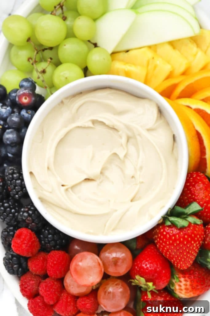 Revive Your Hard Brown Sugar 14 Brown Sugar Cream Cheese Fruit Dip served with a vibrant rainbow of fresh fruit, perfect for dipping.