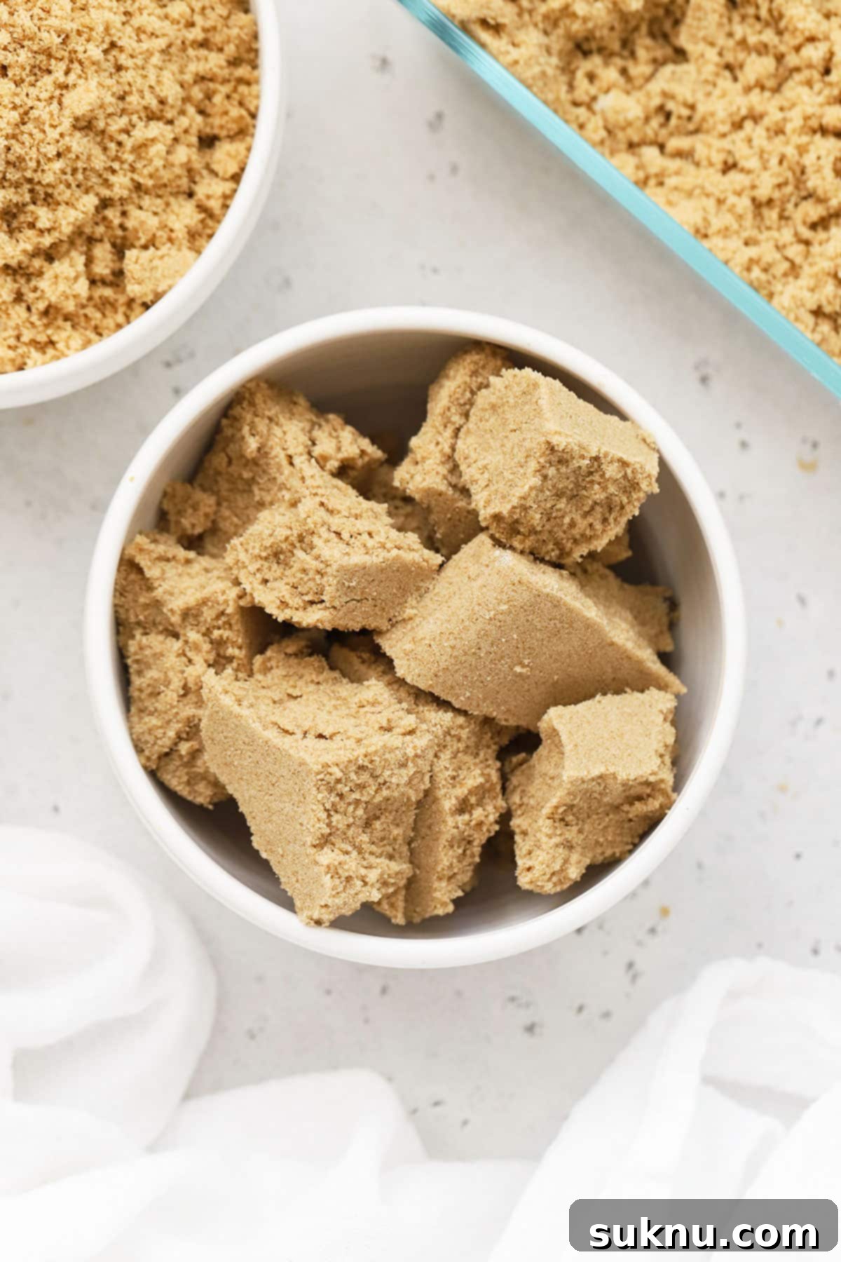 Revive Your Hard Brown Sugar 3 A bowl filled with hard, clumpy brown sugar, illustrating the common problem.