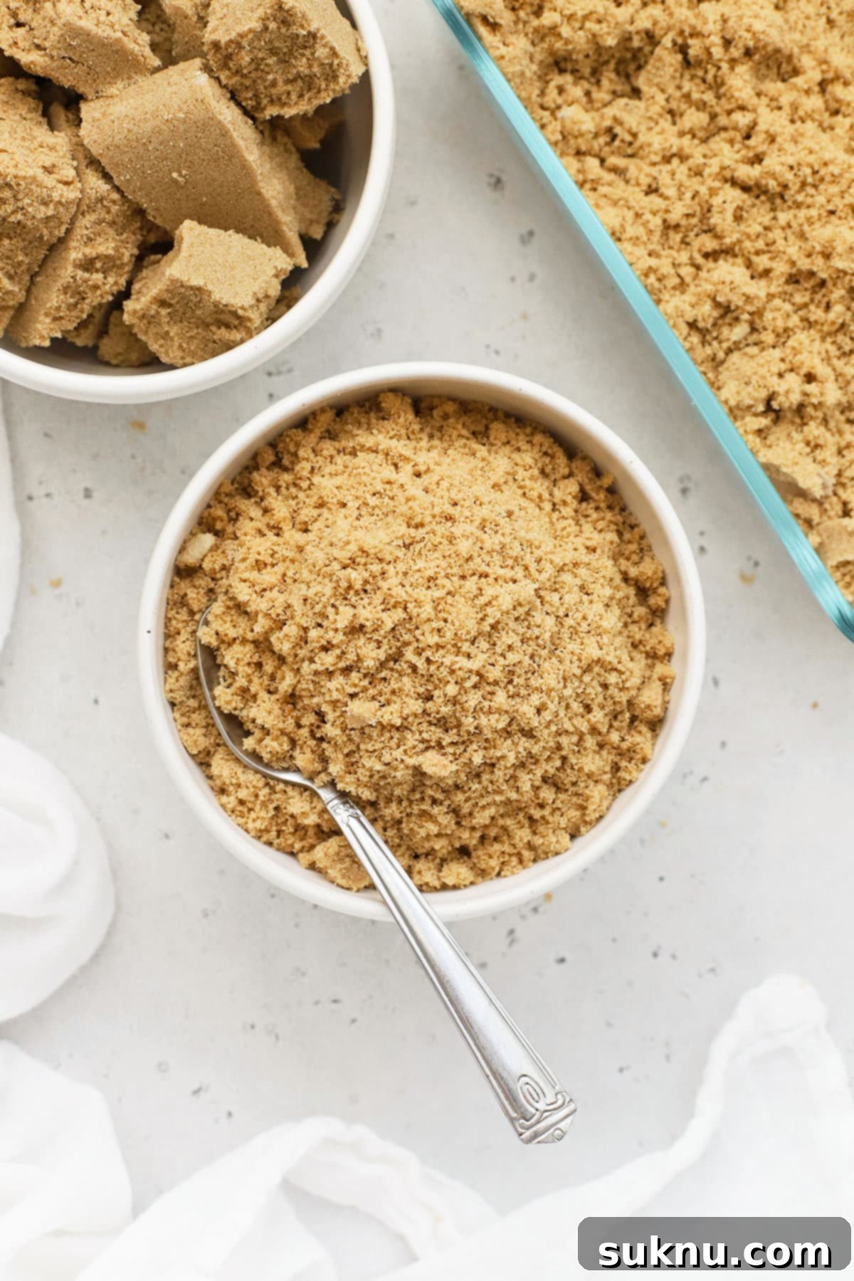 Revive Your Hard Brown Sugar 10 A side-by-side view of a bowl of soft brown sugar and a bowl of hard brown sugar, visually demonstrating the transformation.