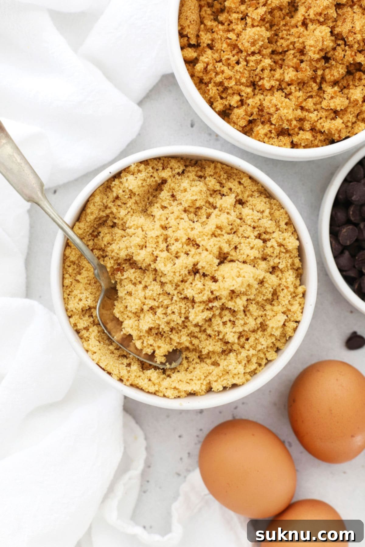 Homemade brown sugar with other cookie ingredients laid out, ready for baking