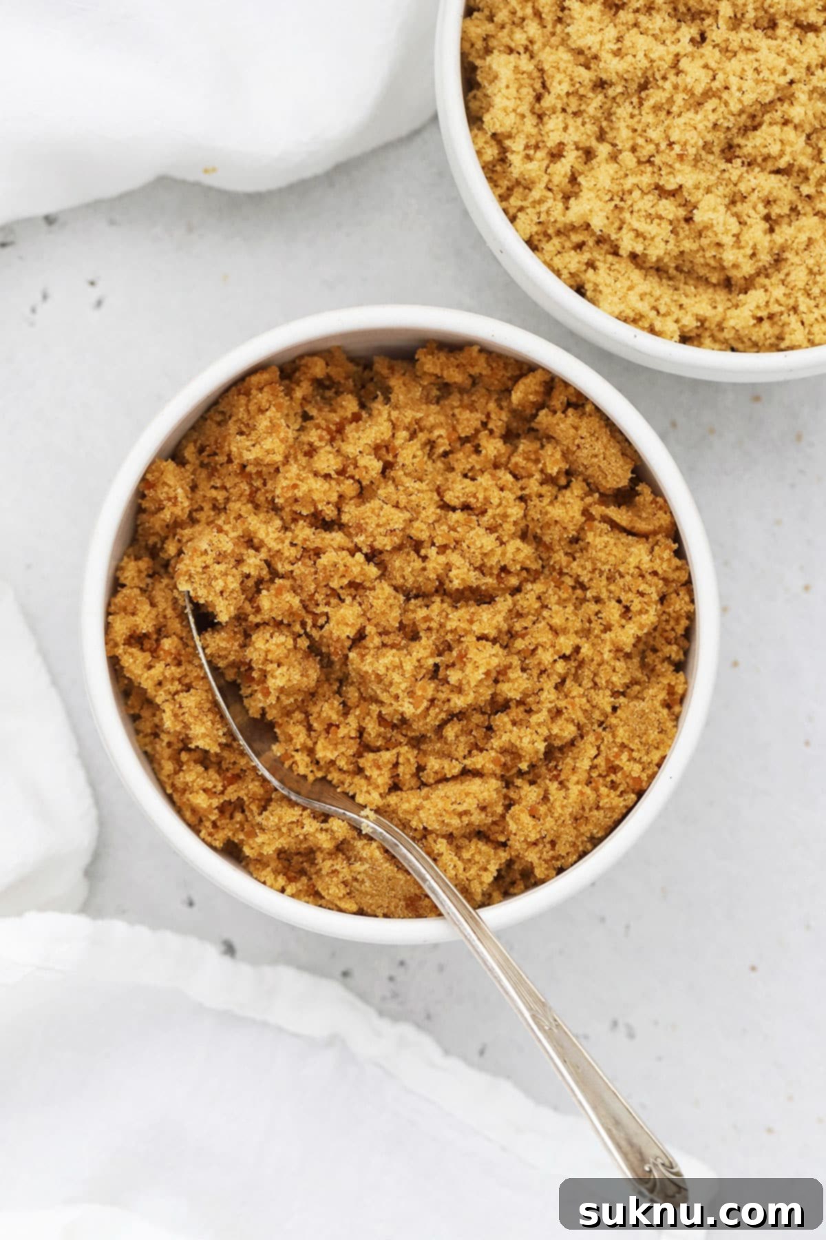 Overhead view of homemade light brown sugar and dark brown sugar in bowls, ready for use