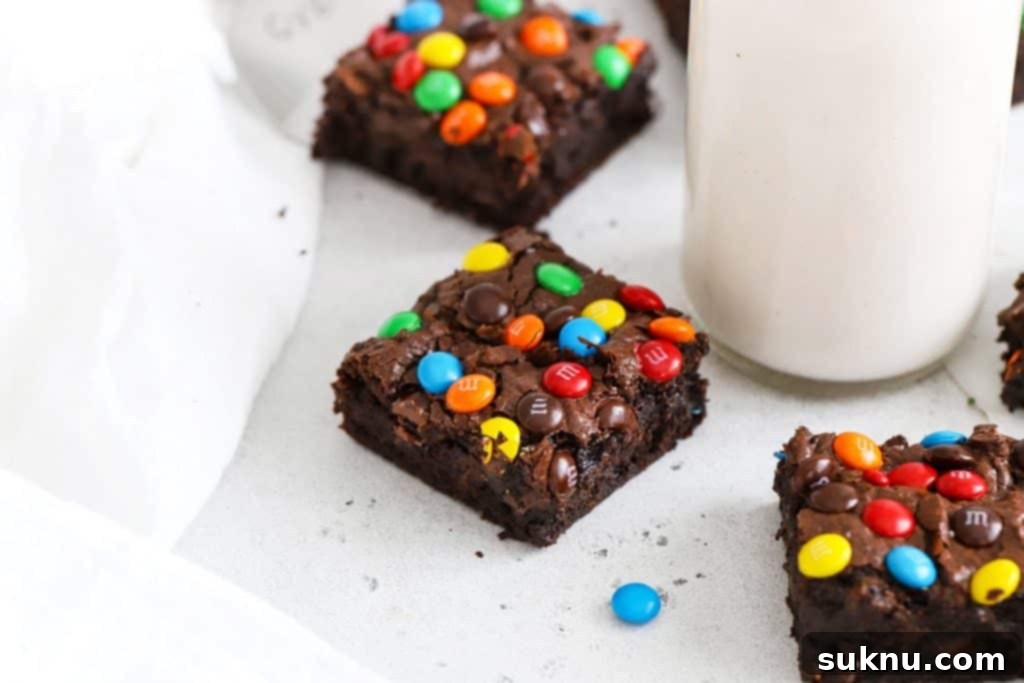 Decadent Gluten-Free Pecan Brownies 9 A front view of several gluten-free M&M brownies, colorful and delicious.