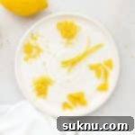 six different sizes of lemon zest on a white plate