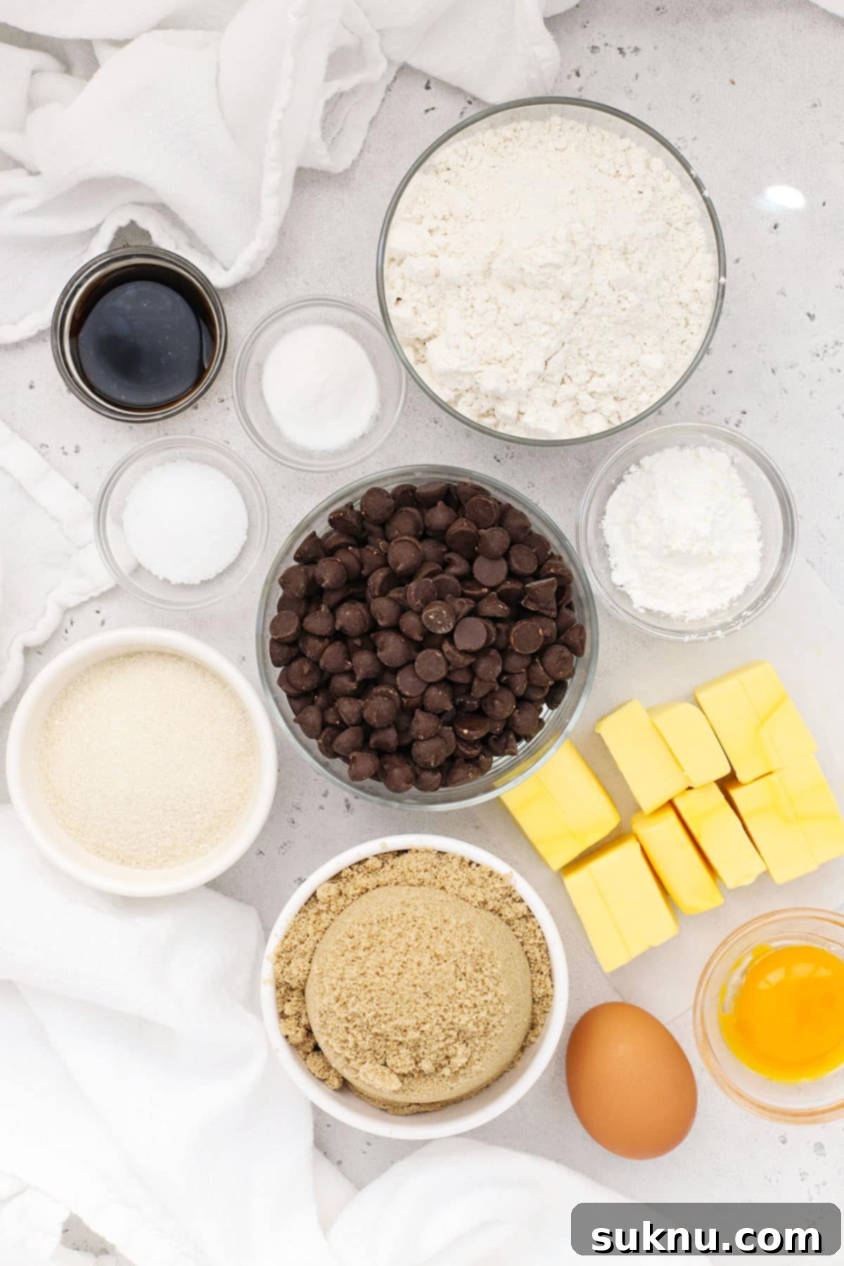 Ultimate Gluten-Free Chocolate Chip Cookie Bars 4 A collection of ingredients for gluten-free chocolate chip cookie bars, including flour, sugars, butter, eggs, and chocolate chips.