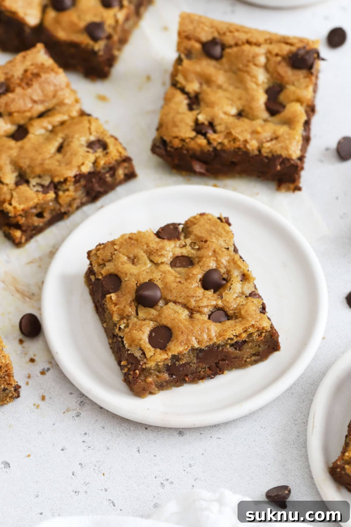 Ultimate Gluten-Free Chocolate Chip Cookie Bars 6 Delicious gluten-free chocolate chip cookie bars, perfectly cut into squares and ready to be served.