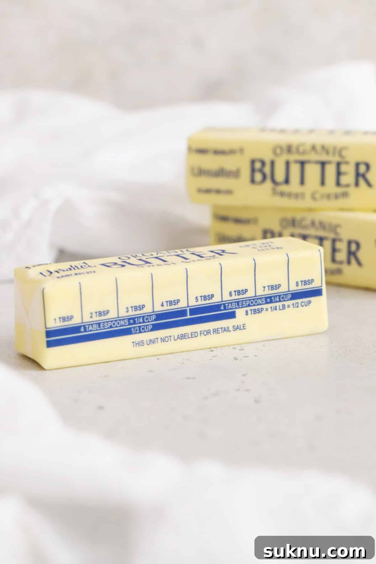 Demystifying Butter Measurement: Sticks, Tablespoons, and More 8 A wrapped stick of butter clearly showing the markings for 8 Tablespoons, indicating easy portioning.