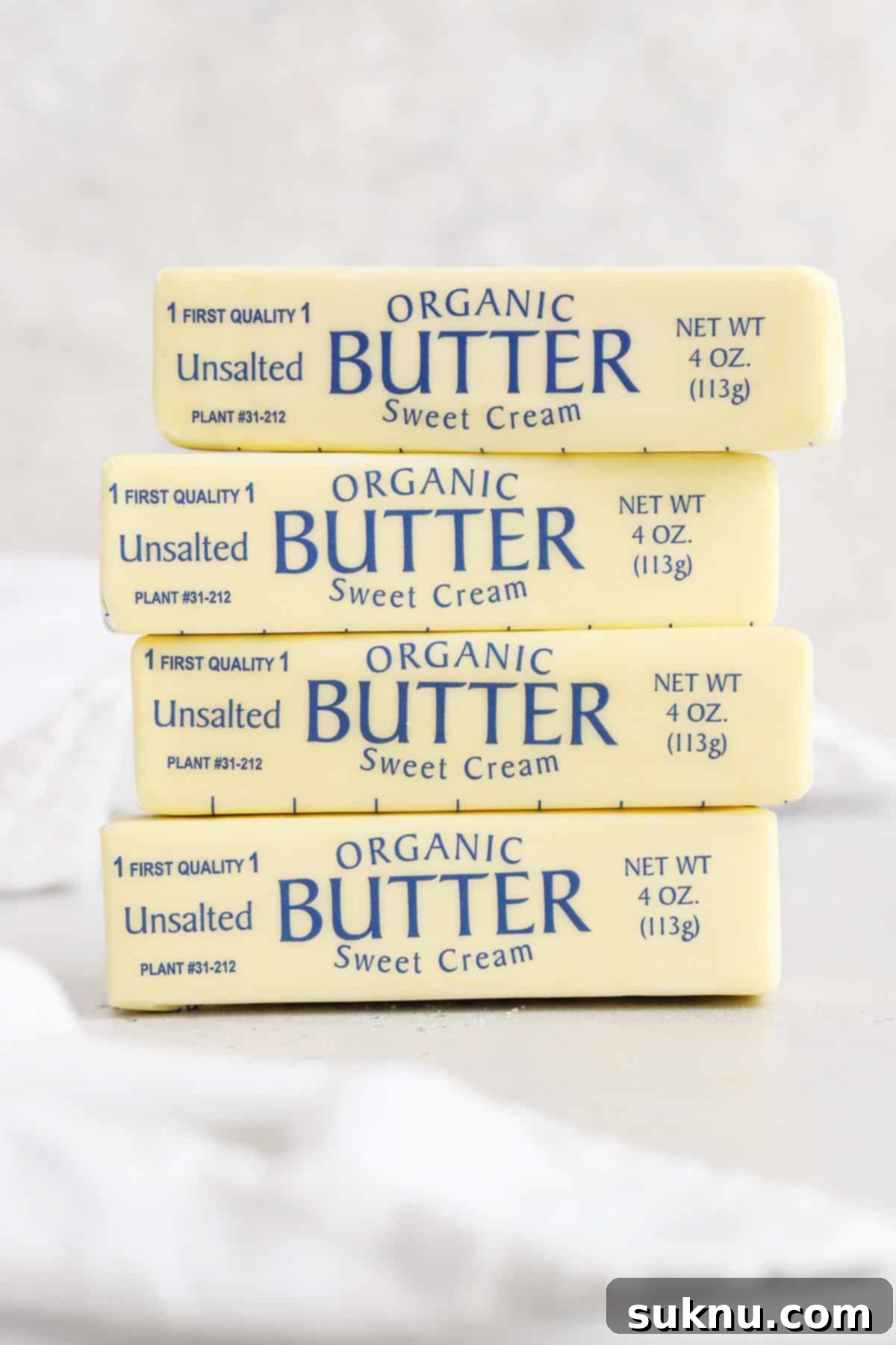 Demystifying Butter Measurement: Sticks, Tablespoons, and More 9 Four sticks of butter, perfectly stacked, ready for various baking applications.
