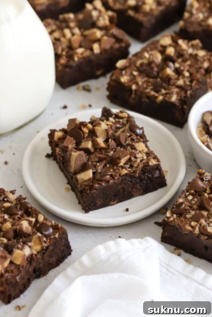 Gluten Free Crunchy Brownies 10 Gluten-free toffee brownies cut into squares, with toffee bits sprinkled on top.