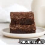 Gluten Free Crunchy Brownies 11 two gluten-free crunch brownies on a white plate