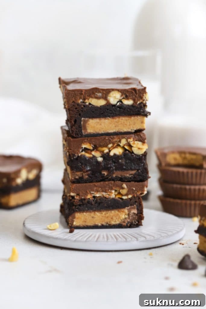 Gluten Free Crunchy Brownies 8 Stacked gluten-free peanut butter cup brownies with creamy peanut butter swirls.