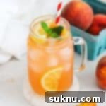 homemade peach lemonade in mason jar glasses