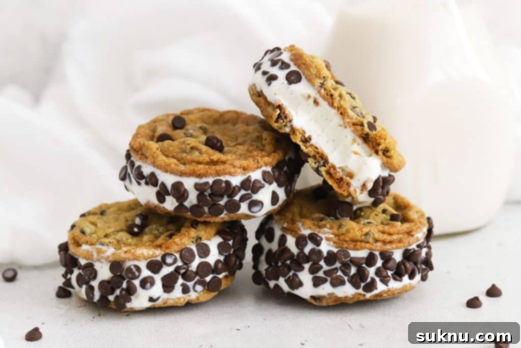 gluten-free chocolate chip cookie ice cream sandwiches stacked on a white background