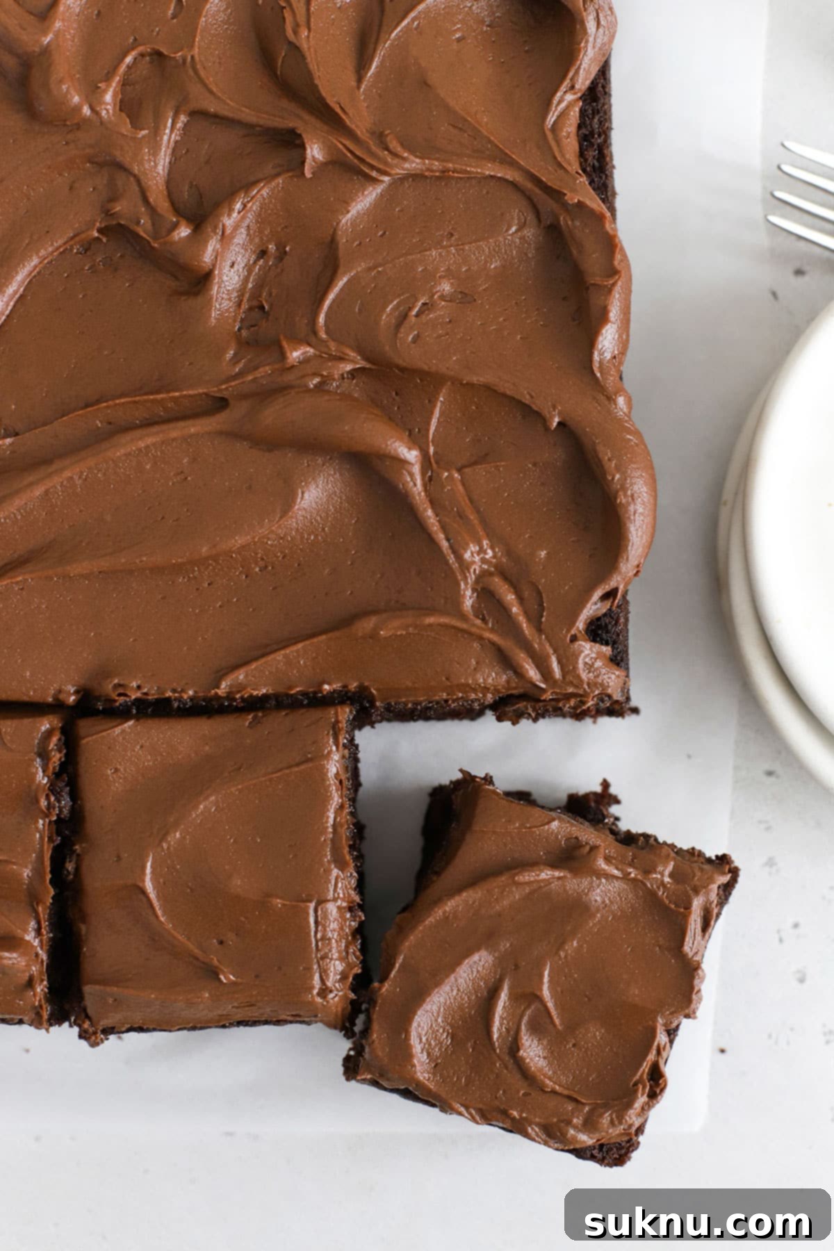 Gluten-free chocolate zucchini cake cut into perfect squares, ready to serve.