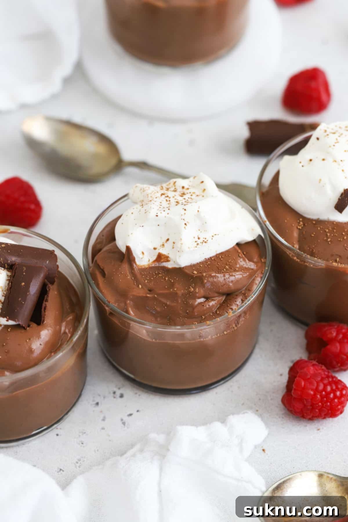 homemade gluten-free chocolate pudding topped with whipped cream