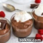 homemade gluten-free chocolate pudding topped with whipped cream