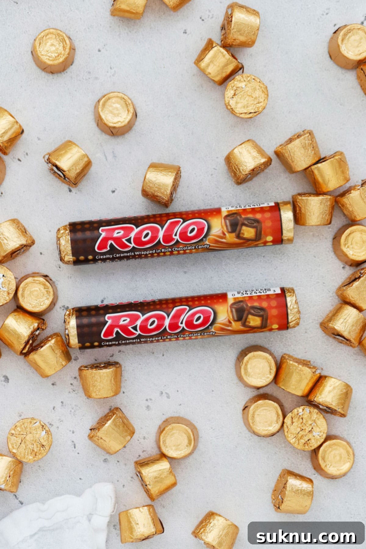 two packages of rolos on a white background with more rolo candy
