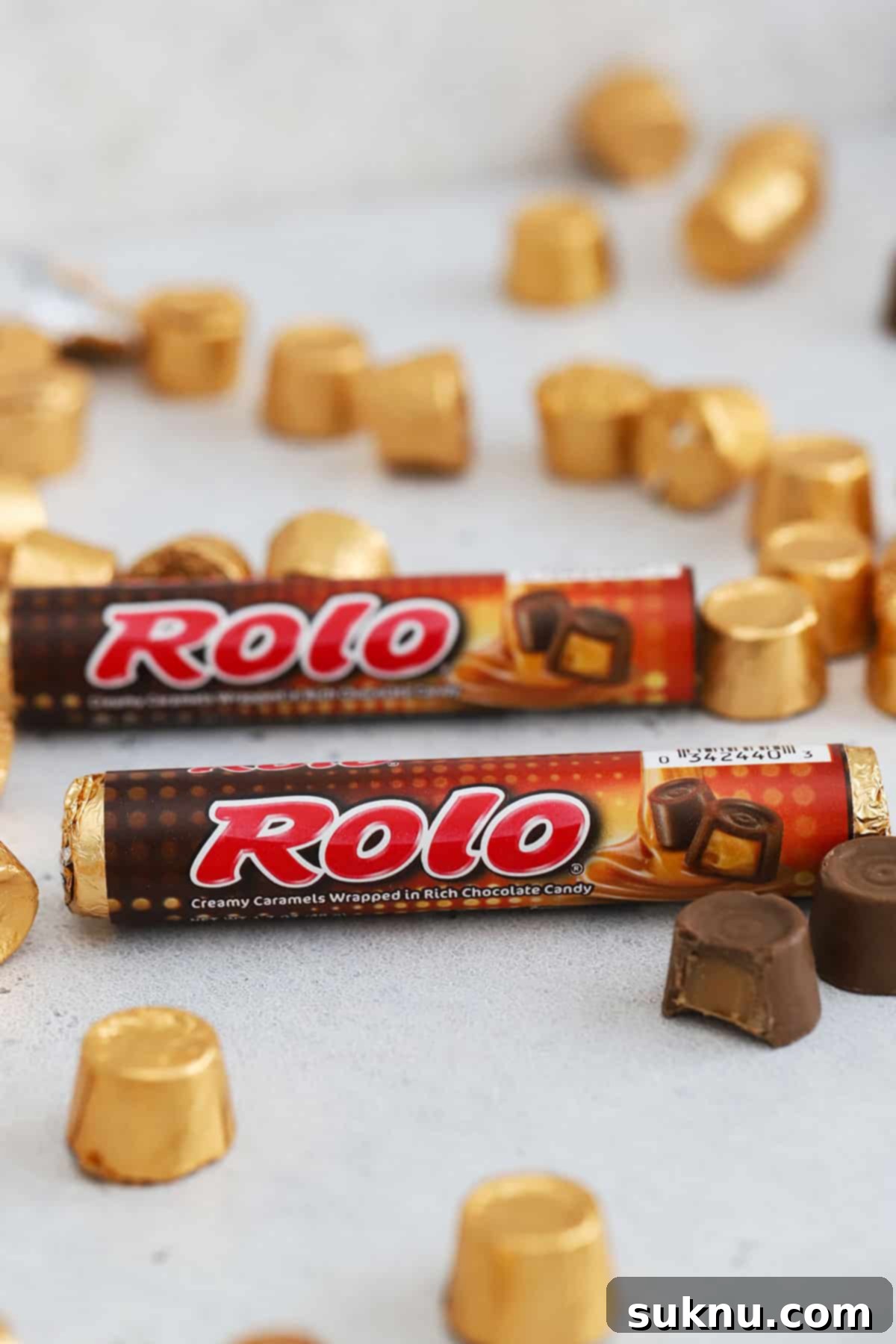 two packages of rolos on a white background with more rolo candy