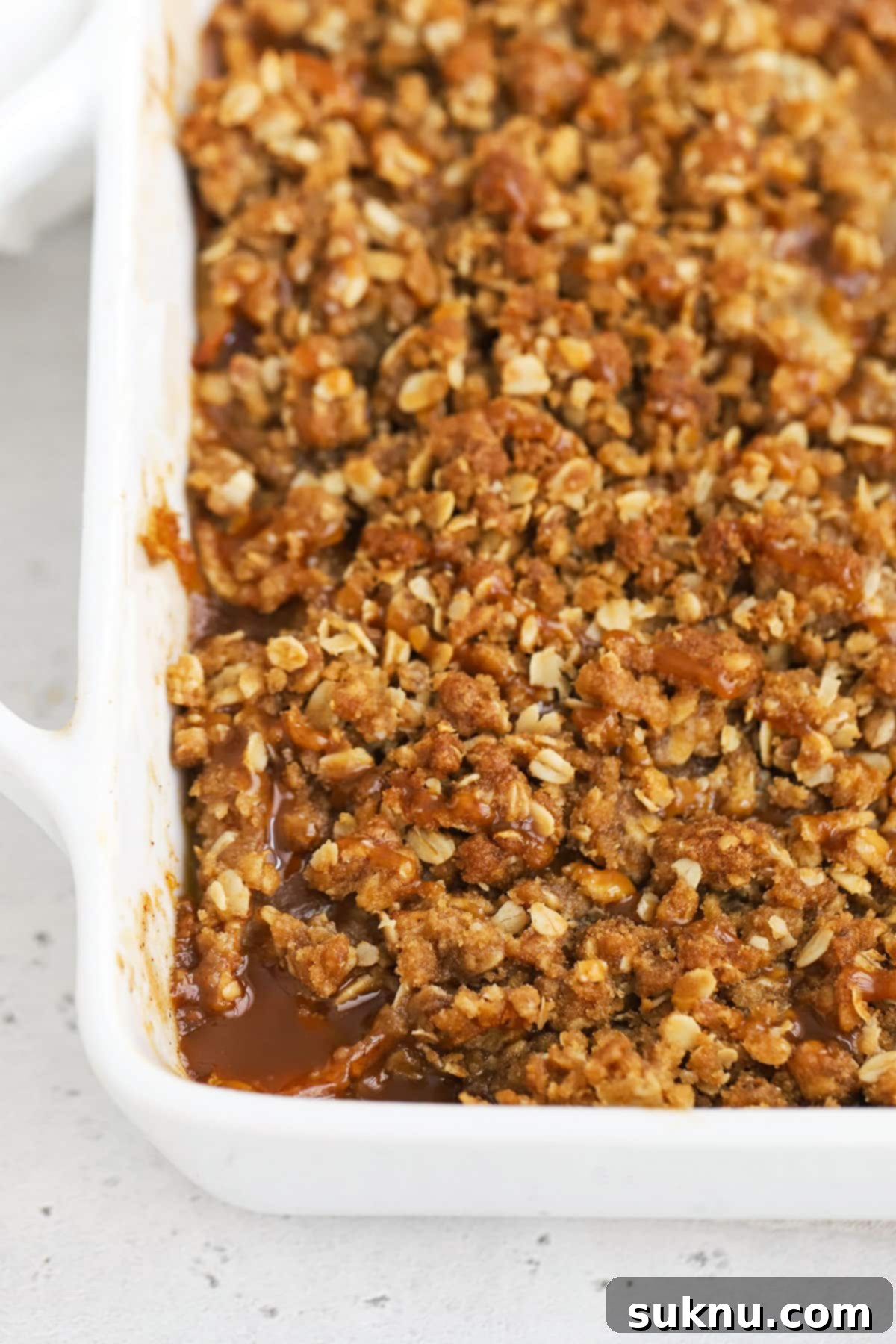 Decadent Gluten-Free Caramel Apple Crisp 5 A bubbling pan of freshly baked gluten-free caramel apple crisp.