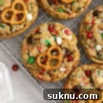 freshly baked gluten-free Christmas kitchen sink cookies on a cooling rack