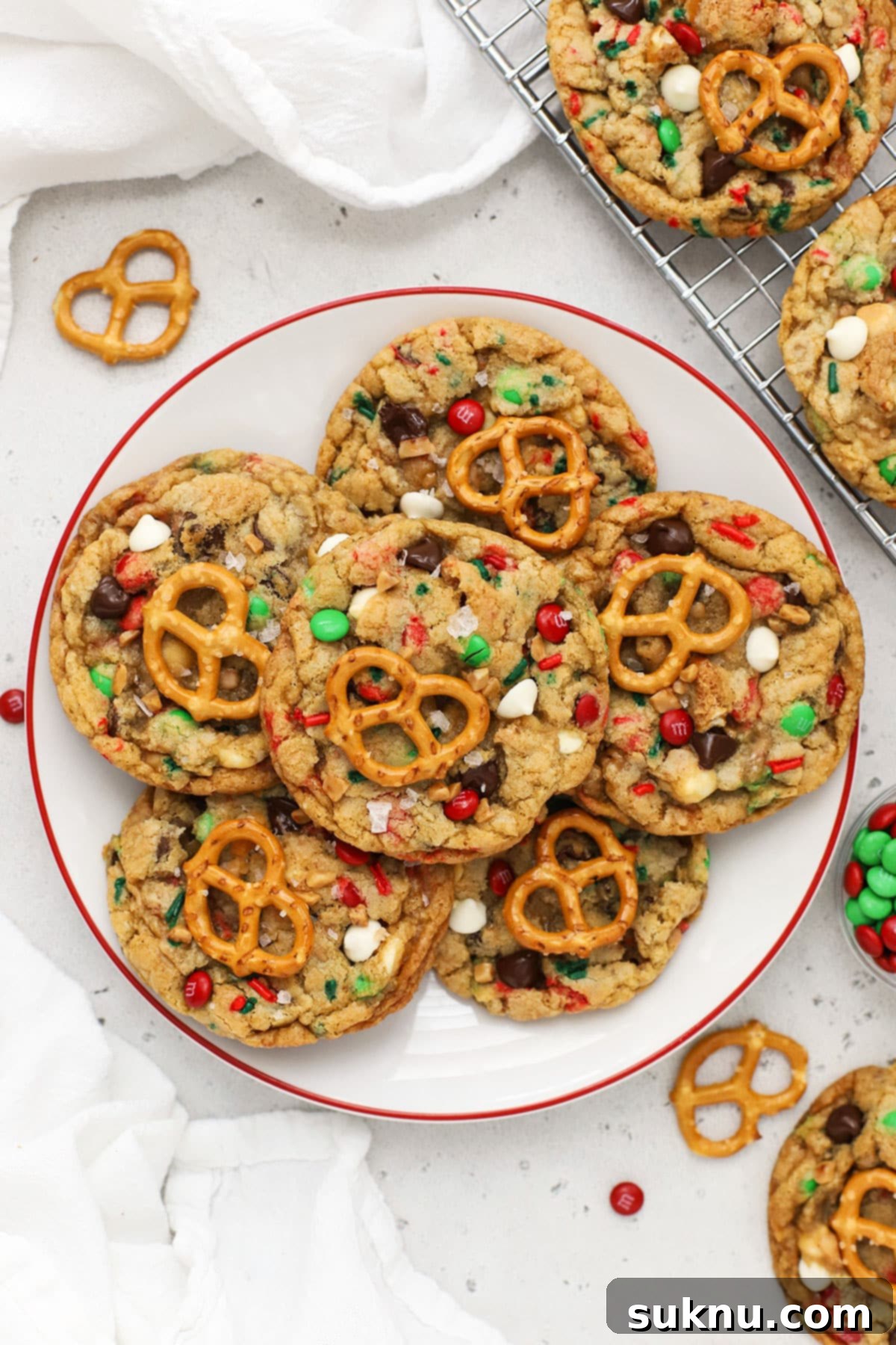 Gluten-free Christmas kitchen sink cookies served on a white plate with a red rim