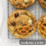 Gluten Free Everything Cookies 9 gluten-free kitchen sink cookies on a wire cooling rack