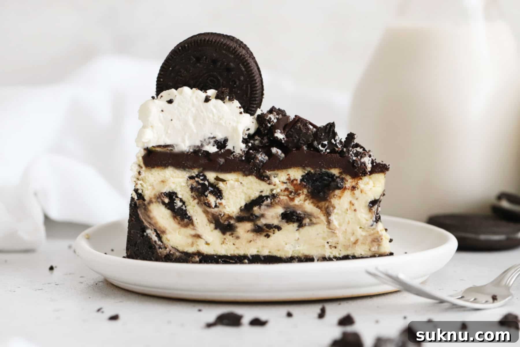 Ultimate Gluten-Free Oreo Cheesecake 14 slice of gluten-free Oreo cheesecake topped with chocolate ganache, chopped Oreo cookies, and whipped cream