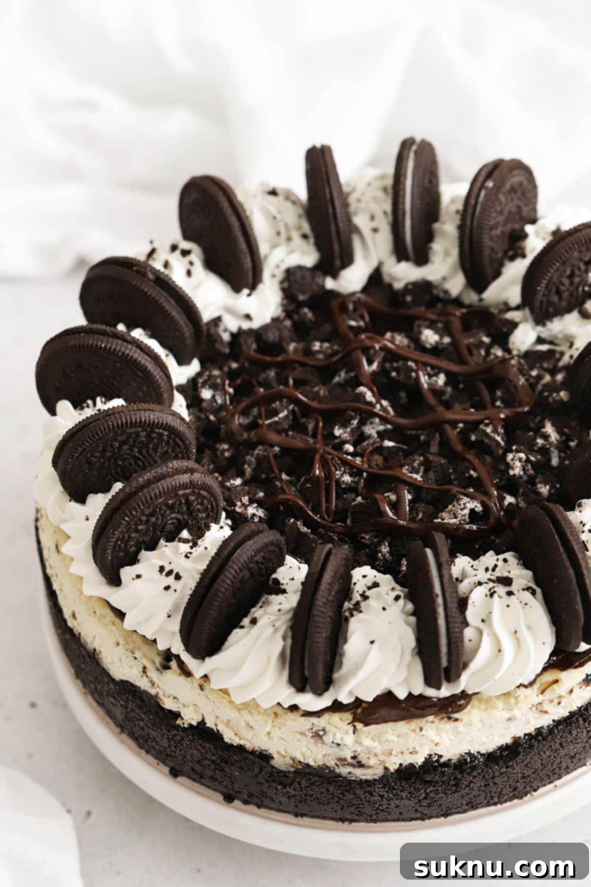 Ultimate Gluten-Free Oreo Cheesecake 6 Whole Gluten-Free Oreo Cheesecake Topped With Whipped Cream Swirls, Chocolate Ganache & Oreo Cookies