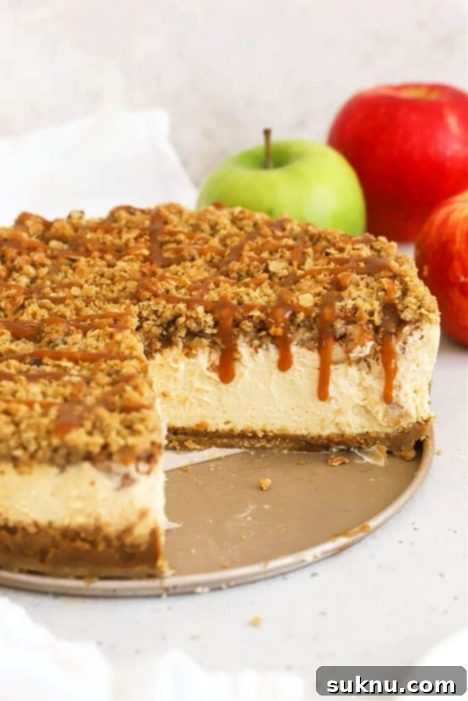 gluten-free apple crumble cheesecake drizzled with caramel sauce