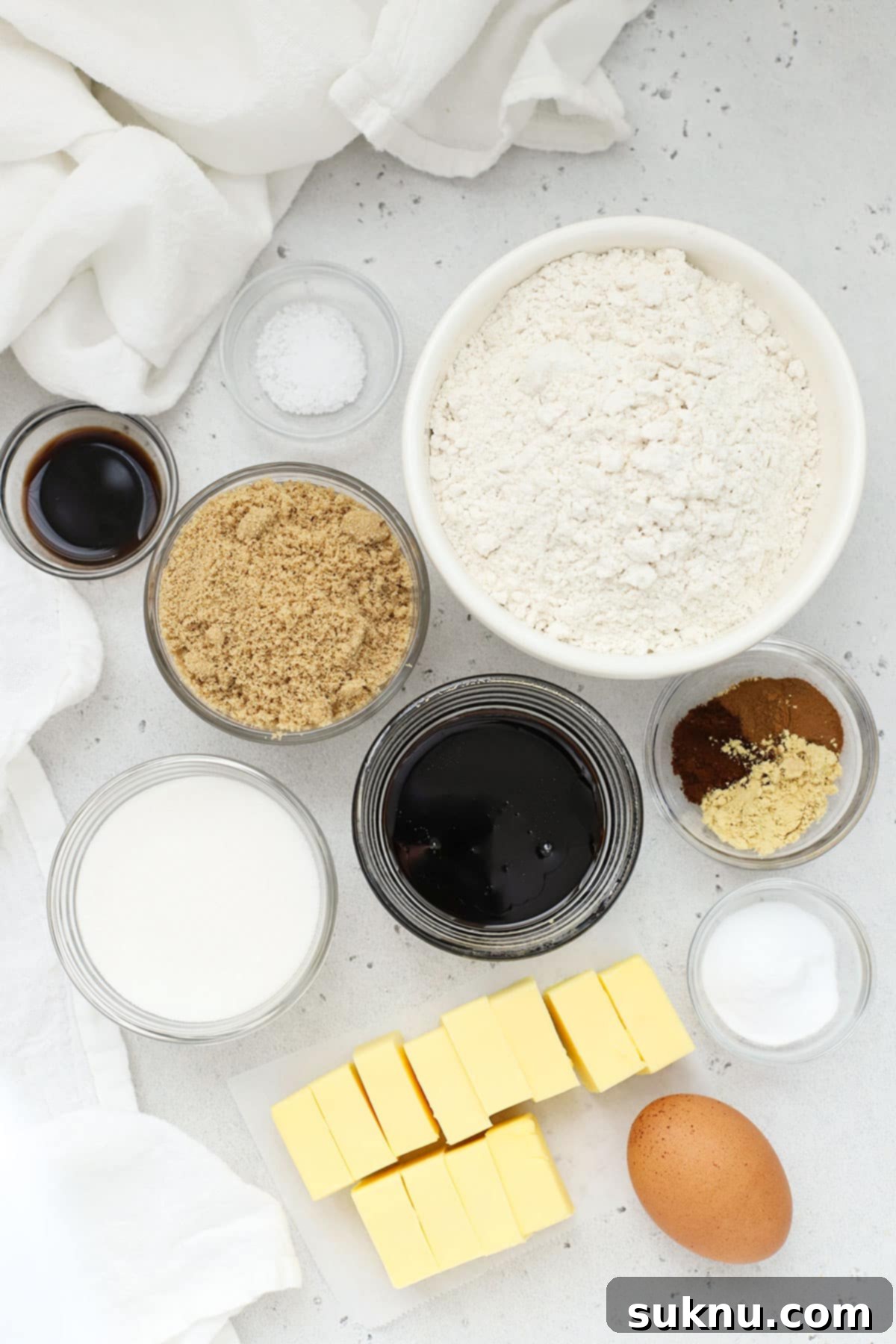 Essential ingredients laid out for baking gluten-free molasses cookies, highlighting pantry staples.