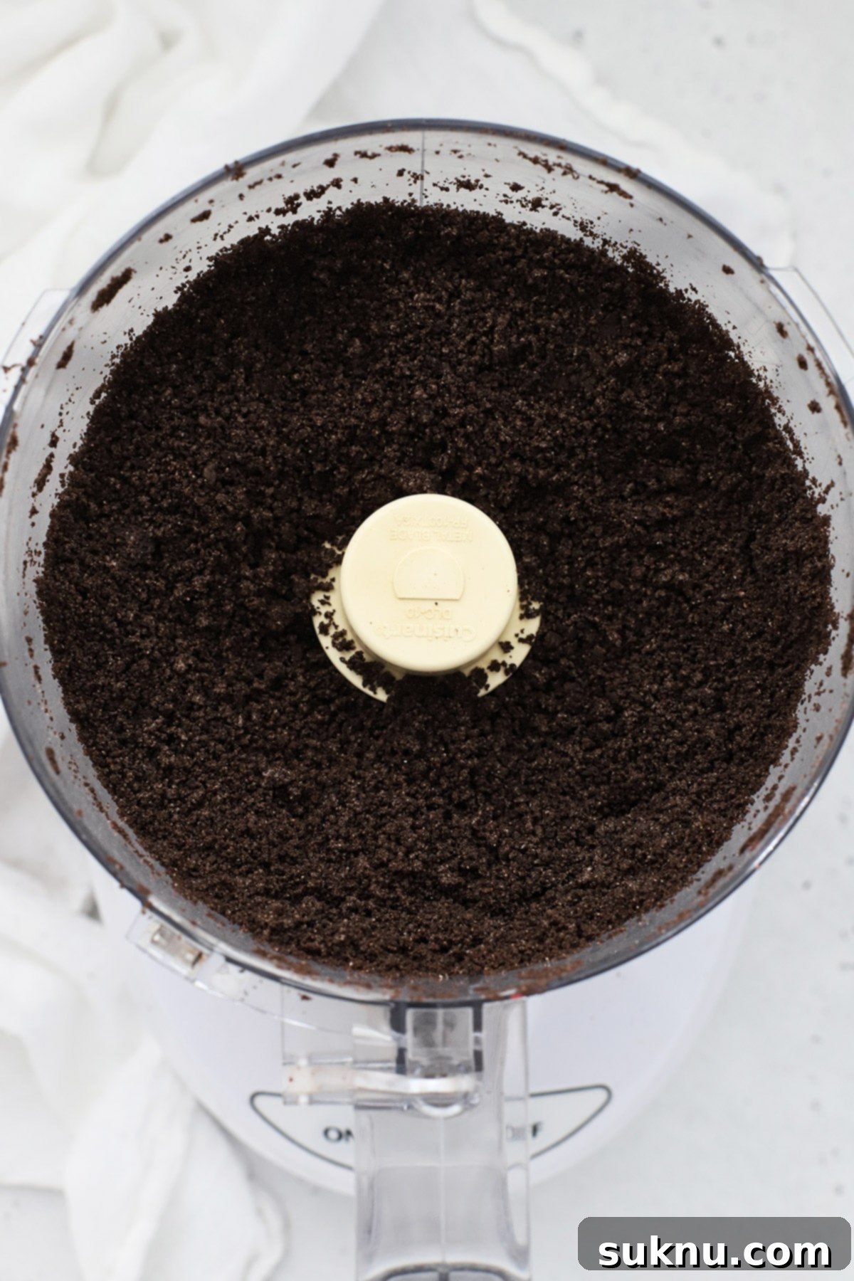 Decadent Gluten-Free Chocolate Pie 4 Crushed gluten-free Oreo crumbs, mixed with melted butter, prepared for shaping into a delicious pie crust.