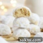 Gluten-Free Snowball Cookies 12 gluten-free snowball cookies stacked in a column