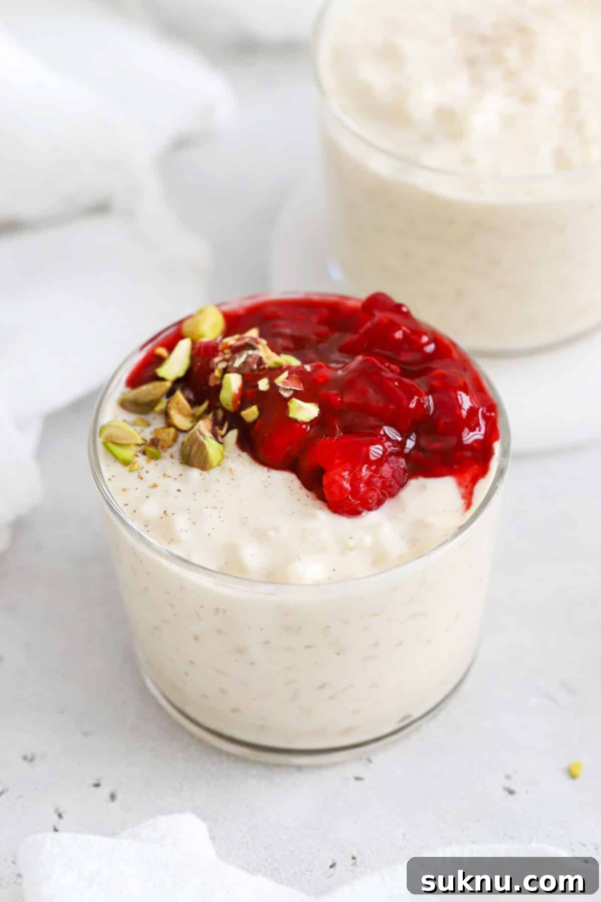 Velvety Gluten-Free Rice Pudding 5 gluten-free rice pudding with raspberry sauce and pistachios